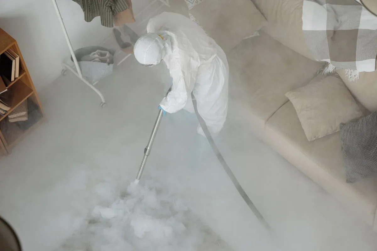 Biohazard cleanup technician in protective equipment, Hunters Mill, San Antonio, TX